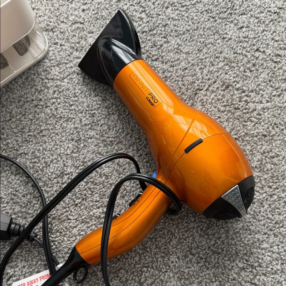 Orange Travel Hair Dryer with Foldable Handle organizer